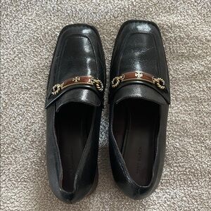 Tory Burch Black Leather Slip-Ons with Gold Accent